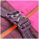 Close-up of a purple and pink pet harness buckle with a metal ring and strap, featuring a bright orange zipper.