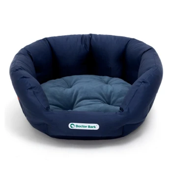 Marineblaues Haustierbett mit einem weichen, gepolsterten Innenraum, mit einem Logo, das "Doctor Bark" liest.