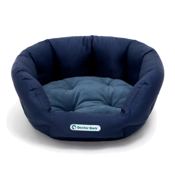 Marineblaues Haustierbett mit einem weichen, gepolsterten Innenraum, mit einem Logo, das "Doctor Bark" liest.