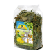 Ein klarer Beutel mit getrockneten Löwenzahnblättern mit einem bunten "JR FARM"-Etikett und Illustrationen eines glücklichen Kaninchens und Hamsters.