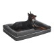 Schwarzer Dobermann ruht auf grauem Feandrea-Hundebett mit Rand, Fleece-Mitte und weißer Paspelierung.