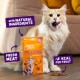 Fluffy cream cat licking lips next to orange PILLOWS treat bag labeled 'Natural ingredients', 'Fresh meat', '<2 kcal treat'