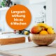 Schüssel mit verschiedenen Früchten, darunter Bananen, Mangos und Zitronen auf einem Holztisch, mit einem orangefarbenen Kreis, der 'Langzeitwirkung bis zu 6 Wochen' angibt.