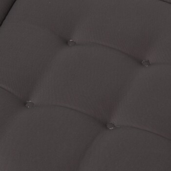 Nahaufnahme eines schwarzen Haustierbettes mit gepolstertem Stoff und sichtbaren Nähdetails.