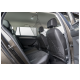 Black pet safety net installed between the front and back seats of a car, designed to keep pets secure while traveling.