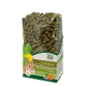 Eine durchsichtige Tüte mit JR Farm "Grainless" Kaninchenfutter für Zwergkaninchen, mit grünen Pellets und bunten Pflanzenmotiven.