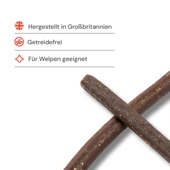 Zwei braune Kau-Sticks für Hunde gekreuzt; sichtbarer Text: 'Hergestellt in Großbritannien; Getreidefrei; Für Welpen geeignet'.