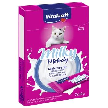 Vitakraft Milky Melody Milchcreme für Haustiere, mit einer rosa Box, einem blauen Teller und einem Beutel, beschriftet mit 'Milchcreme pur' in mehreren Sprachen.