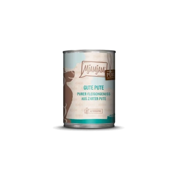 Dose Mjamjam Hundefutter mit der Aufschrift 'Gute Pute' und einer Illustration eines braunen Hundes, die besagt 'purer Fleischgenuss aus zarter Pute.'
