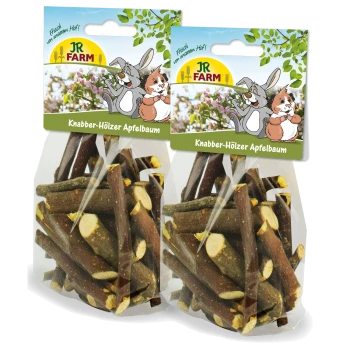 Dwie przezroczyste torby z gryzieniem z jabłoni JR FARM dla małych zwierząt, z zabawnymi rysunkami królików na opakowaniu.