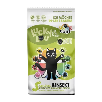 Bunte Haustierfuttertüte mit einer Cartoon-Schwarzen Katze. Text: "LUCKY LOU DER ECHTE GESCHMACK! ERWACHSEN," mit "Getreidefrei" und "Kein Zuckerzusatz."