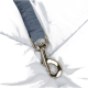 Close-up of a silver metal clip attached to a light blue pet harness, featuring a gathered fabric strap.