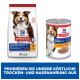 Die Verpackung von Hill's Science Plan Hundefutter zeigt einen lächelnden Hund. Links: Trockenfutter für reife Erwachsene 7+, rechts: Dosenfutter mit Huhn.