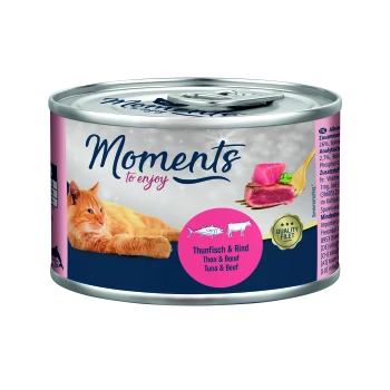 Cat food can featuring a playful orange cat, labeled "Moments to enjoy," with a pink circle stating "Thunfisch & Rind" (Tuna & Beef).