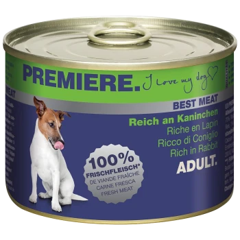 Blik hondenvoer gelabeld 'Premiere' met een hond die zijn lippen likt, met de tekst '100% Vers Vlees' en 'Rijk aan Konijn' in meerdere talen.