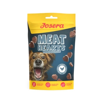Josera Meat Hearts Hundeleckerli-Tüte mit begeistertem Hund und herzförmigen Snacks; Aufschrift: 'Weiche und schmackhafte Trainingssnacks'.