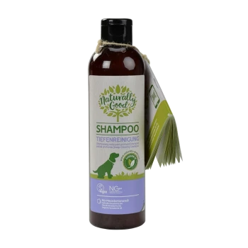 Butelka szamponu dla psów "Naturally Good" z zielonym konturem psa i tekstem podkreślającym "wegański" i "organiczny olej makadamia."