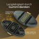 Zwei schwarze Gummistriegel mit PFERDEGOLD‑Riemen; deutscher Text „Langlebigkeit durch Gummi‑Borsten“