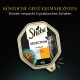 Sheba Selection Katzenfutter in Sauce, mit einer Portion Rind und Truthahn, verpackt in einer 85g Schale mit grünem Garnitur.