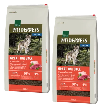 Two 12 kg bags of Real Nature Wilderness dog food "Great Outback," with wolf imagery, 70% meat, 30% fruits/vegetables, no grains.