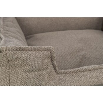 Eine Nahaufnahme eines weichen, grauen Haustierbettes mit strukturiertem Stoff und gepolsterten Seiten, ideal für kleine Hunde oder Katzen.