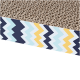 A close-up of a cat scratching pad with a textured brown surface, featuring a colorful zigzag patterned border in blue, yellow, and white.
