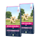Dwie torby suchej karmy dla szczeniąt Eukanuba z wizerunkiem wesołego szczeniaka golden retrievera z przodu, z informacjami o wieku i wadze.