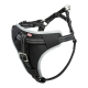 Schwarzes Haustiergeschirr mit reflektierenden Nähten und verstellbaren Riemen, mit einem Trixie-Logo auf der Vorderseite.