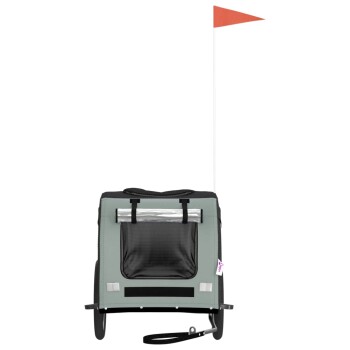 Haustierträger auf Rädern, mit grauer Außenseite, schwarzen Akzenten, transparentem Oberteil und einer roten Fahne zur Sichtbarkeit.
