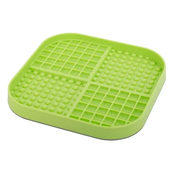 Grüne Silikon-Haustierfütterungsmatte mit unterteilten Abschnitten, ausgestattet mit strukturierten Oberflächen für Halt und Stabilität.