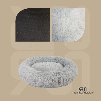 Ein plüschiges graues Haustierbett mit flauschigem Außenmaterial und einem rutschfesten schwarzen Boden, mit dem Markenlogo "ROHRSCHNEIDER."