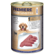 Dose Hundefutter mit der Aufschrift "Premiere Meati Sensitive", das reines Lamm als Hauptzutat enthält, mit sichtbaren Fleischstücken und einer Hundillustration.