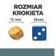 Obrazek porównujący rozmiary krokietów dla zwierząt: okrągły krokiet o średnicy 12 mm obok niebieskiej kostki pokazującej 16 mm, z napisem "ROZMIAR KROKIETA."