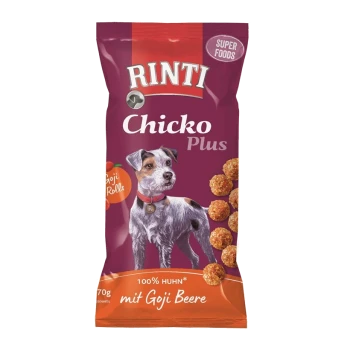 Emballage de friandises pour chiens Rinti Chicko Plus avec un fond violet, une illustration de chien et un texte indiquant "100% Huhn mit Goji Beere."