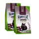 Zwei Beutel Happy Cat Adult Sterilised Farm Lamb Katzenfutter mit schwarzem Katzenbild auf der Verpackung.