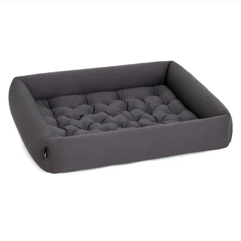 Grauem Haustierbett mit einem gepolsterten Design und erhöhten Rändern, das Komfort und Unterstützung für Haustiere bietet.