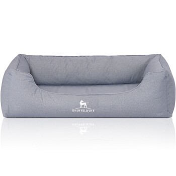 Graues Hundebett mit einem weichen, gepolsterten Design, das das Logo "KNUFFELWUFF" auf der Vorderseite zeigt.