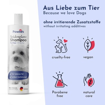 Zufriedener Hund in einer Metallwanne beim Waschen; Werbetext ‚Angenehmer Duft‘ und Pawlie’s-Logo.