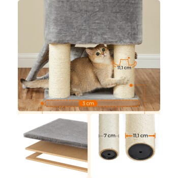 Eine verspielte Katze mit grünen Augen klettert auf einen grauen Kratzbaum mit zwei mit Sisal umwickelten Kratzsäulen, mit Abmessungen von 11,1 cm und 3 cm.