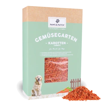 PAWS & PATCH Gemüsegarten Karotten Hundesnack-Box (Karotten) mit Sichtfenster, das orangefarbene Flocken zeigt, und einem kleinen Haufen Flocken.