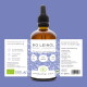 Eine Frau mit langen Haaren hält eine schwarze Katze neben einem wolfähnlichen Hund, umgeben von lila Blumen. Text darüber bewirbt Wolfsbacher Naturprodukte.