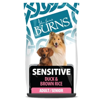 Dog food bag featuring "Burns Sensitive Duck & Brown Rice" for adult/senior dogs, with images of a collie and a small dog.