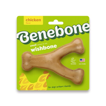 A rubber dog chew toy shaped like a bone, featuring a textured surface and a light brown color with speckles.