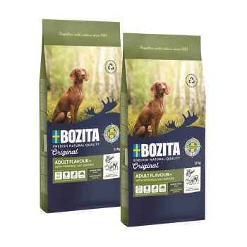 Deux sacs de nourriture pour chiens Bozita, étiquetés "Adult Flavour+" avec renne, 12 kg chacun, présentant un chien brun dans un cadre naturel.