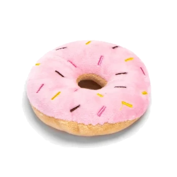Ein pinkfarbener, mit Zuckerguss überzogener Hundekeks in Form eines Donuts, dekoriert mit bunten Streuseln, auf einem weißen Hintergrund platziert.