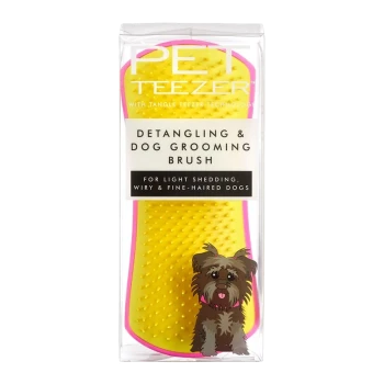 Bright yellow detangling and dog grooming brush in packaging, labeled for light shedding, wiry, and fine-haired dogs, with a cartoon dog illustration.