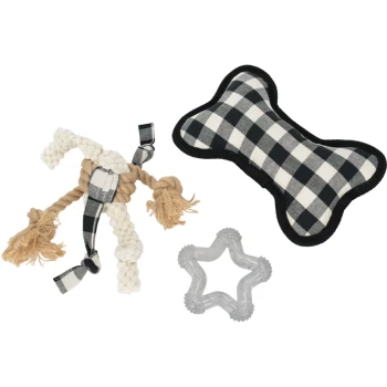 Three pet toys arranged together: a knotted rope toy, a black and white checkered bone-shaped plush toy, and a clear rubber star-shaped toy.