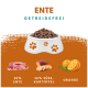 Hundefutter in einer weißen Schüssel mit Pfotenabdrücken, mit 50% Ente, 26% Süßkartoffel und Orange, beschriftet mit "Getreidefrei."