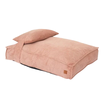 Rechteckiges rosa Cord-Haustierbett mit angebrachtem Kissen und kleinem braunem Etikett an der Seite.