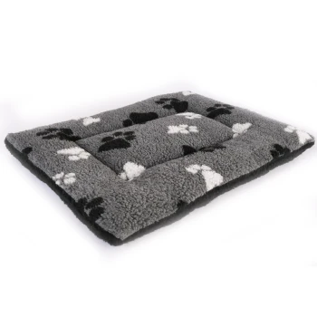 Gray pet bed with a soft, fluffy texture, featuring black and white paw print patterns.